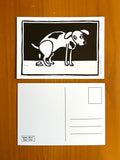 kaart met linoprint van poepende hond door Anne Neuteboom cabaretier Anne Neut Boetiek